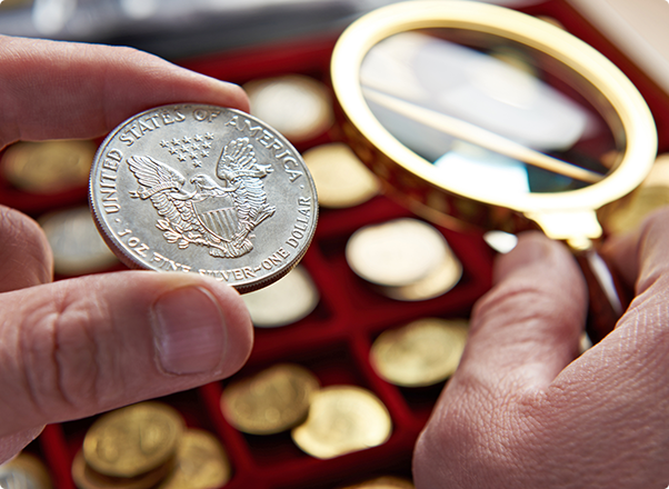 Sell Gold & Silver - Inspecting a Silver Coin